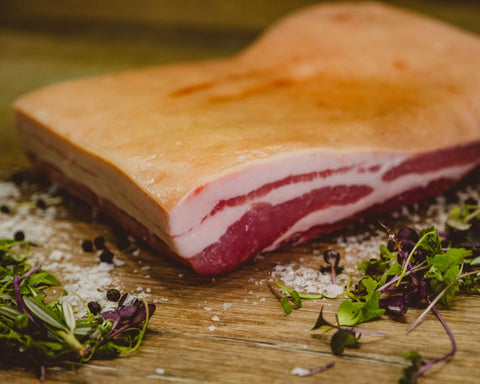Marsh Butcheries Prime Apple Tree pork belly scored ready for an entertainer. 1.5kg