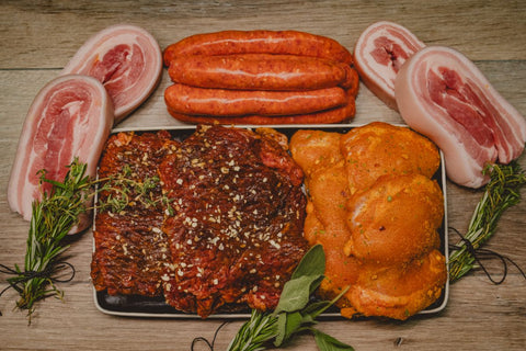 Marsh Butcheries Butcher's Box containing Pork Spare Ribs x 1kg, Thin Beef Sausages x 1kg, Lime & Sweet Chilli Chicken Steaks x 1kg, Smokey BBQ Steak x 1kg