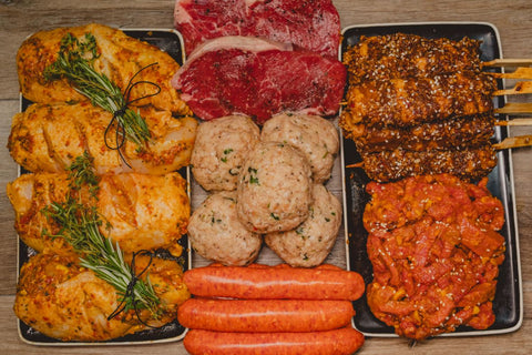 Marsh Butcheries Butcher's Box containing Moroccan Chicken x 4 Pork Belly Skewers x 6 Satay Beef Strips x 1kg Thai Chicken Burgers x 6 Sirloin Steak (Smoked Garlic) x 1kg Prime Beef Sausages (Thick) x 1kg