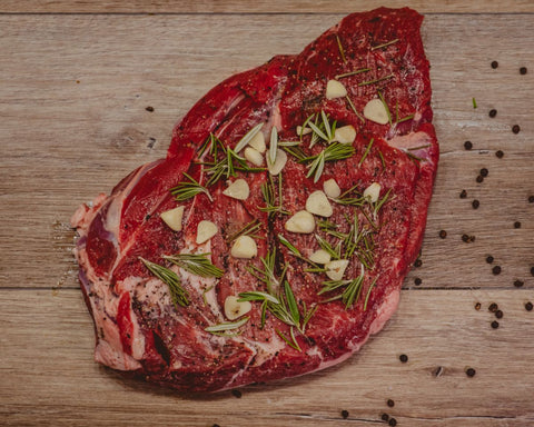 Marsh Butcheries leg of lamb butterflied and seasoned with salt, pepper, garlic and rosemary. (Gluten Free)