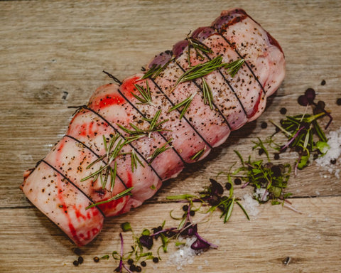 Marsh Butcheries Boneless lamb leg roast seasoned in salt, pepper, garlic, and rosemary.